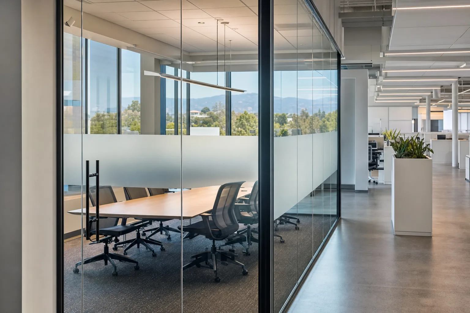 A meeting room with frosted privacy film across its glass walls