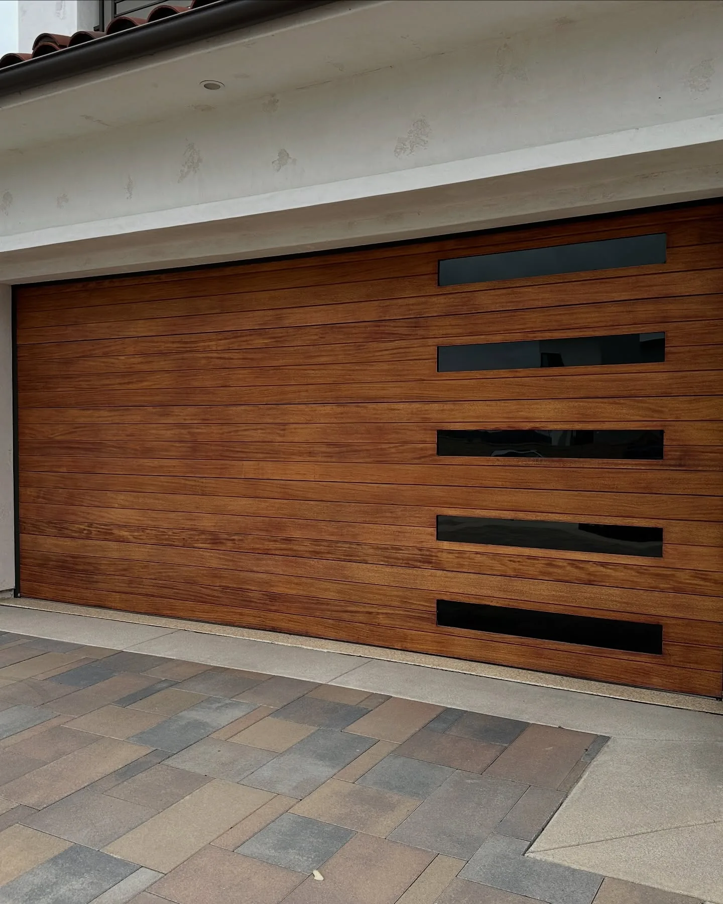 Garage-door glass on a modern home, tinted by us