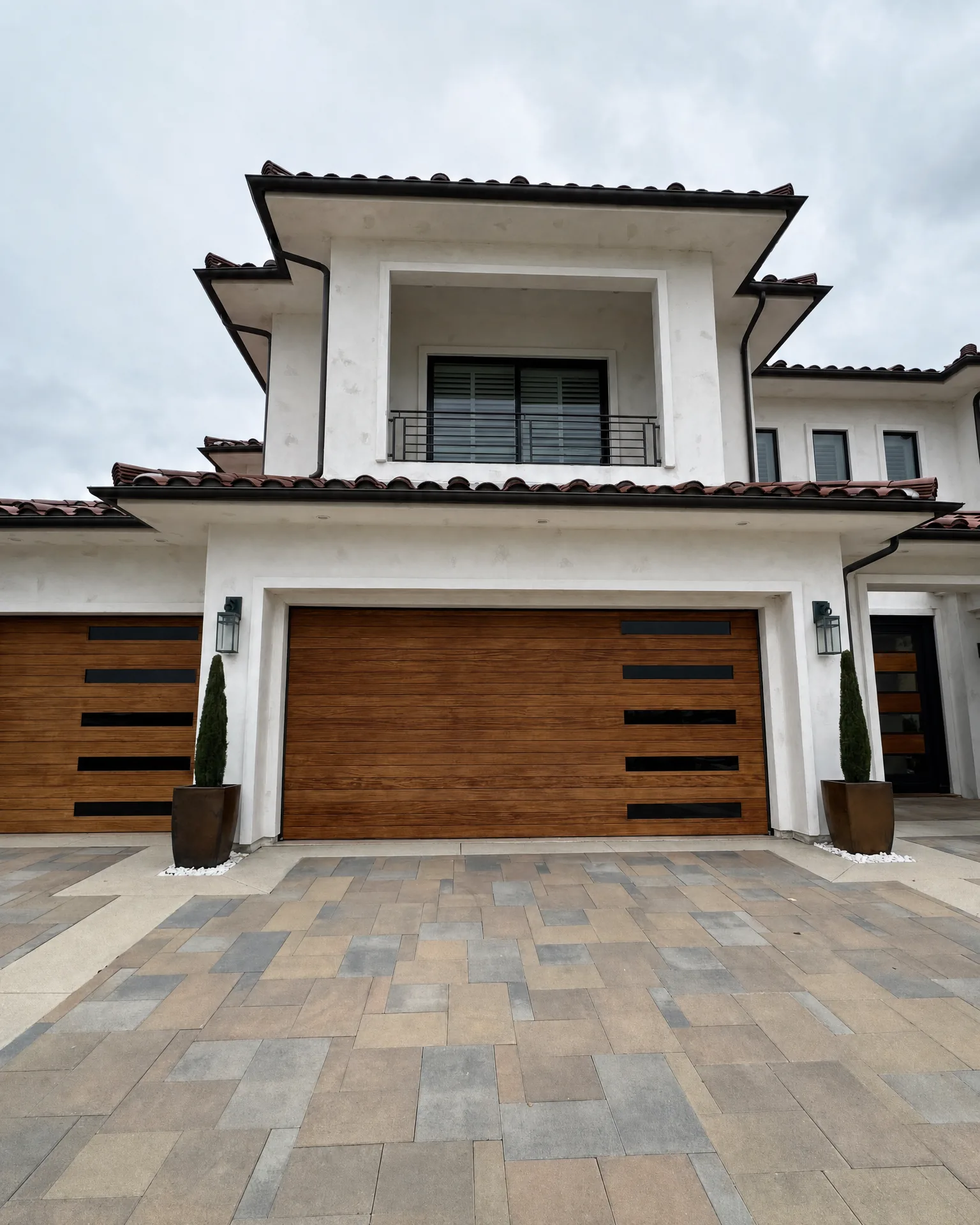 A modern Spanish-style home whose garage-door glass we tinted